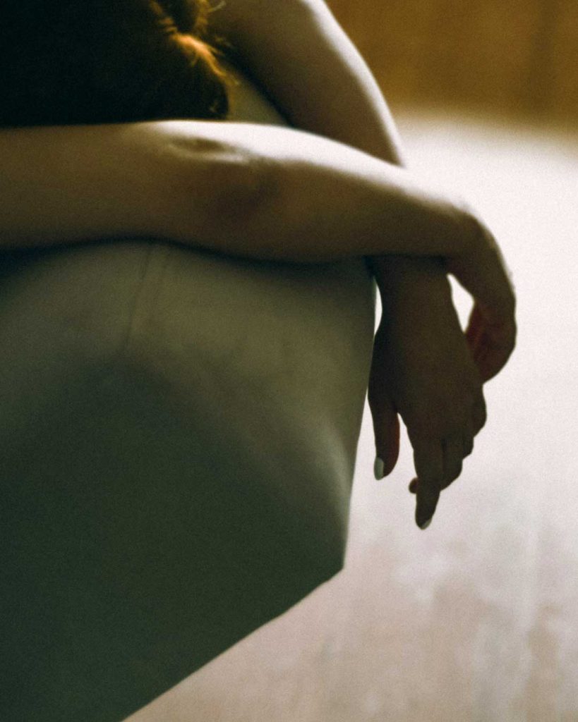Arm resting on a sofa.